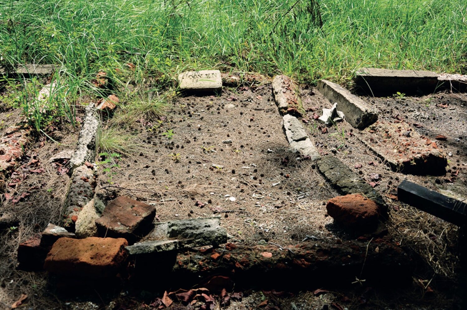 A humble cemetery surrounded by bricks and stone around it, a part of ARTISAN Magazine Vol. 2