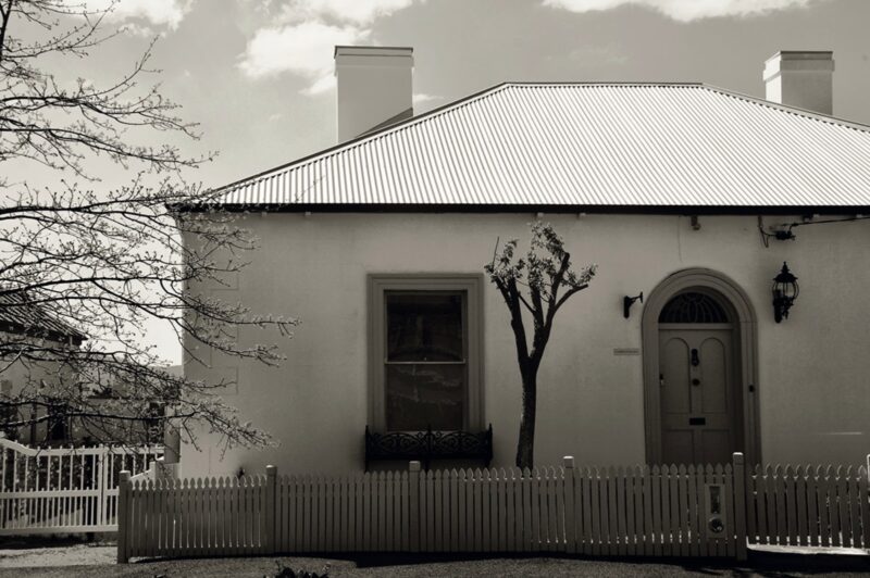 A house with wooden fence and two chimney, a part of ARTISAN Magazine Vol. 3