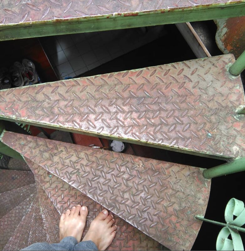 Feet on a rustic stairs